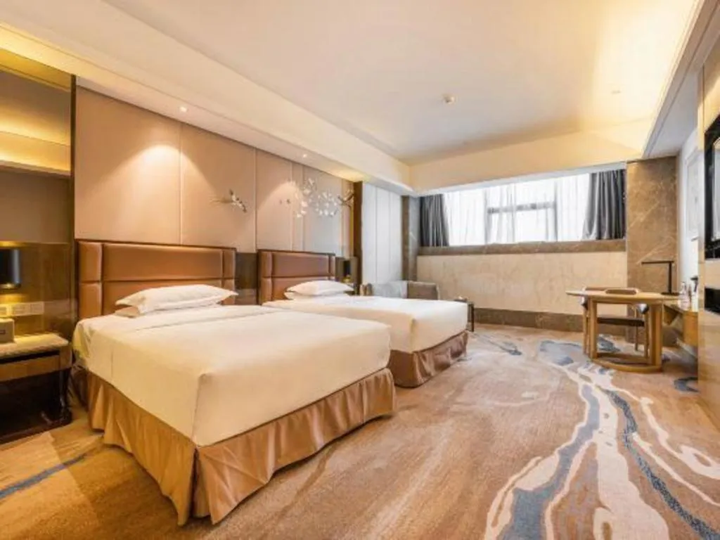 Bed in Licai Tianqi Hotel