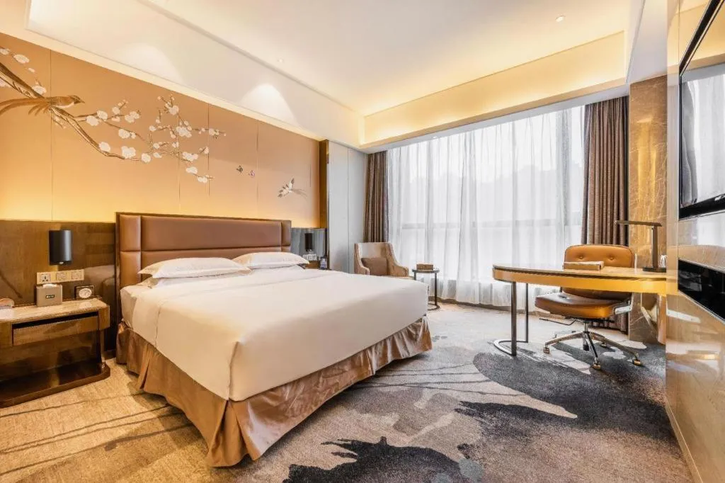 Bed in Licai Tianqi Hotel