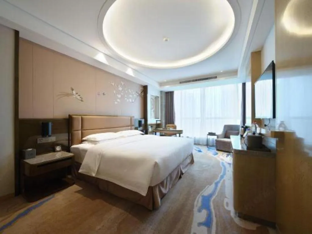 Bed in Licai Tianqi Hotel