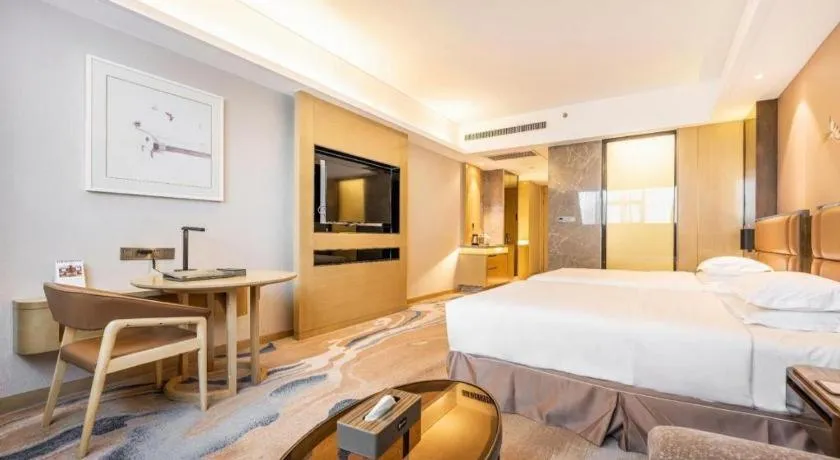 Bed in Licai Tianqi Hotel