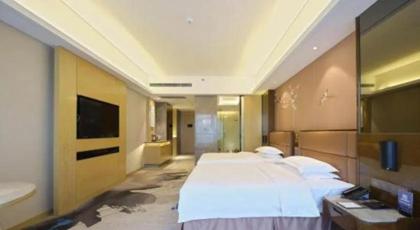 Bed in Licai Tianqi Hotel