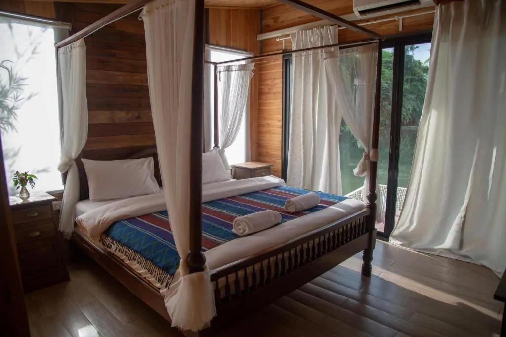 Bed in Le Bassin Erawan Resort