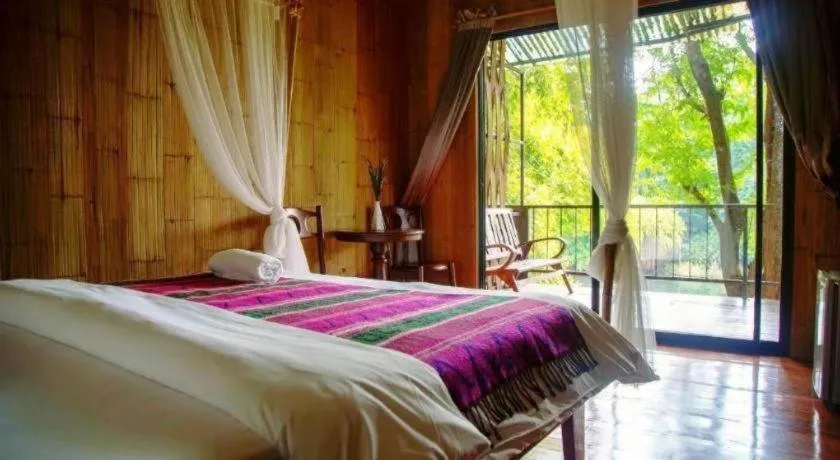 Bed in Le Bassin Erawan Resort
