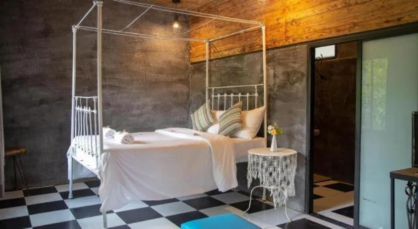 Bed in Le Bassin Erawan Resort