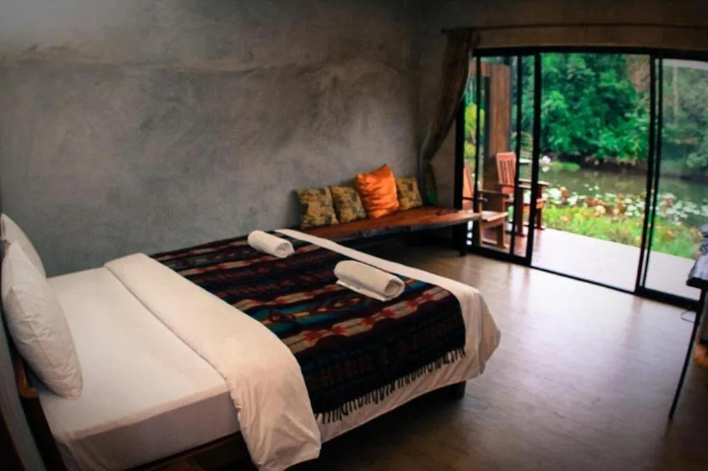 Bed in Le Bassin Erawan Resort