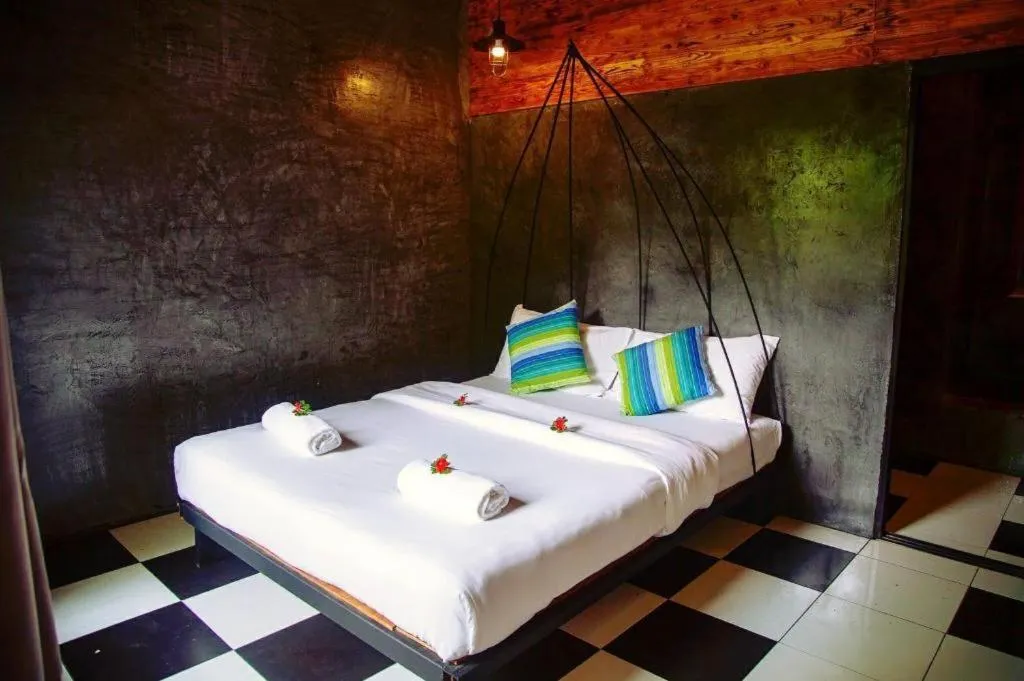 Bed in Le Bassin Erawan Resort