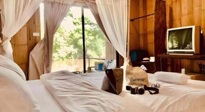 Bed in Le Bassin Erawan Resort