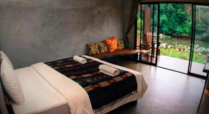 Bed in Le Bassin Erawan Resort