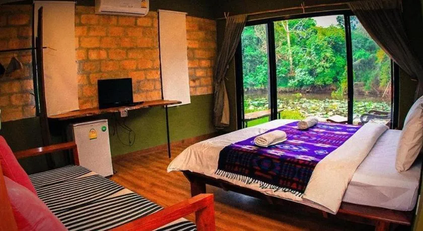 Bed in Le Bassin Erawan Resort