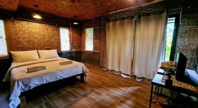 Bed in Le Bassin Erawan Resort