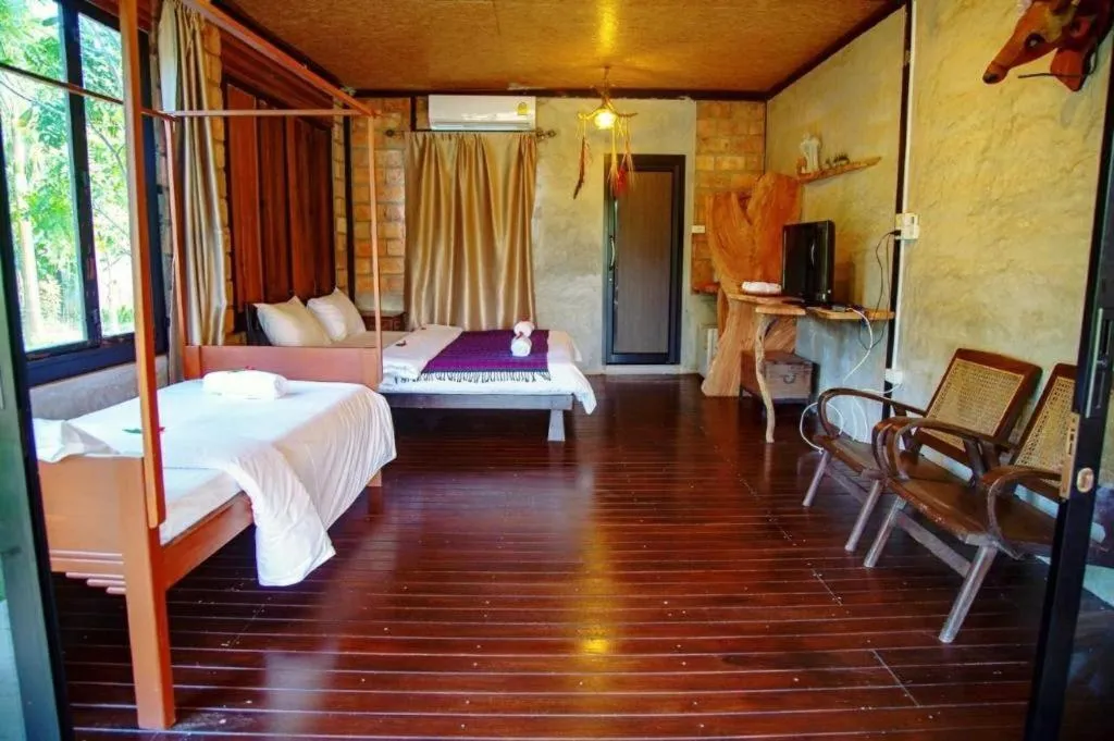 Bed in Le Bassin Erawan Resort