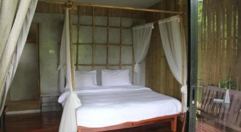 Bed in Le Bassin Erawan Resort