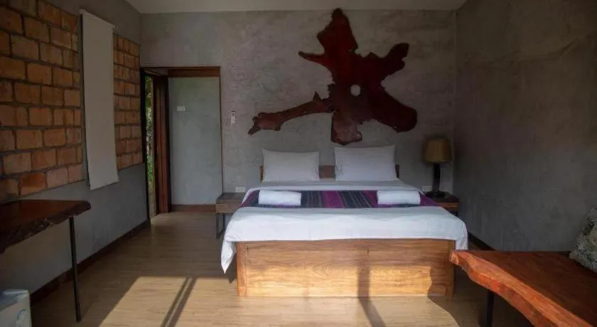 Bed in Le Bassin Erawan Resort