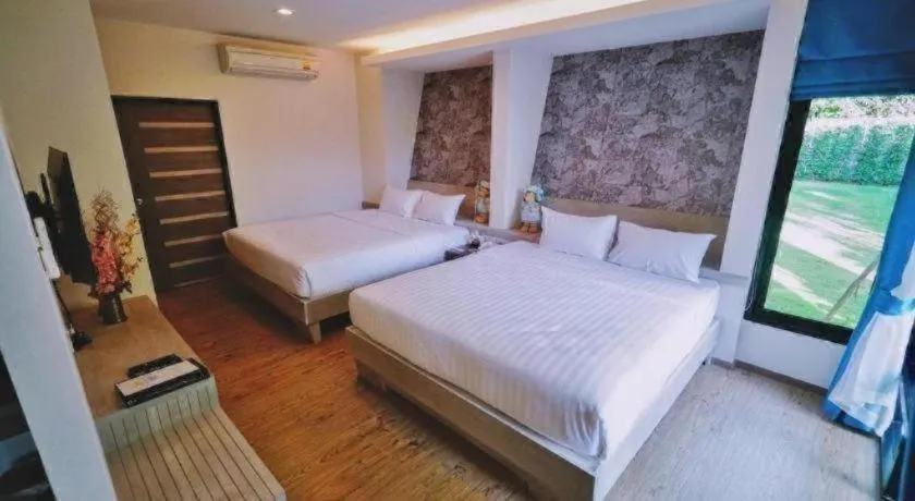 Bed in Chatnipa Beach Resort