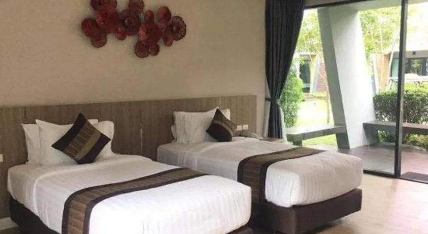 Bed in Chatnipa Beach Resort