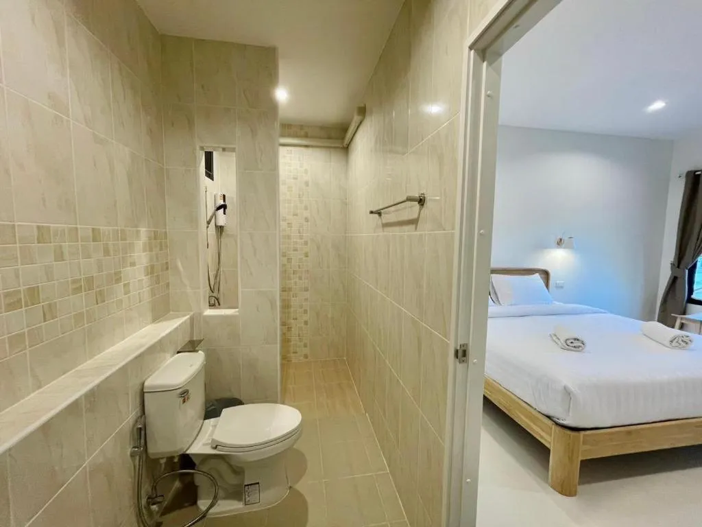 Bed in Baan Klang Suan Resort