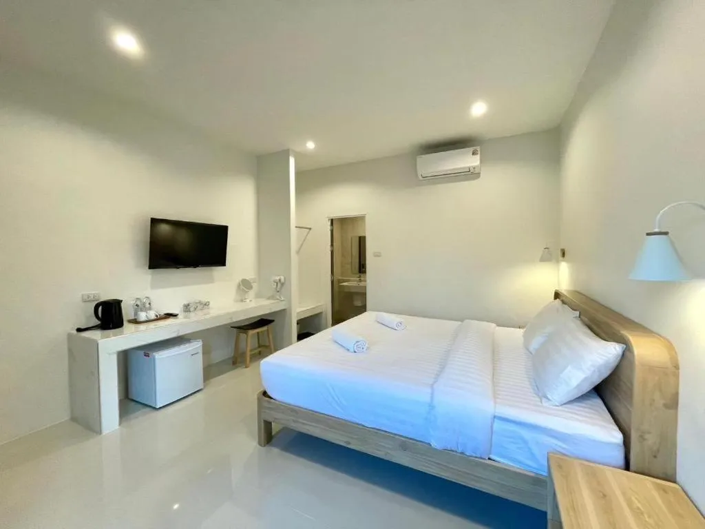 Bed in Baan Klang Suan Resort