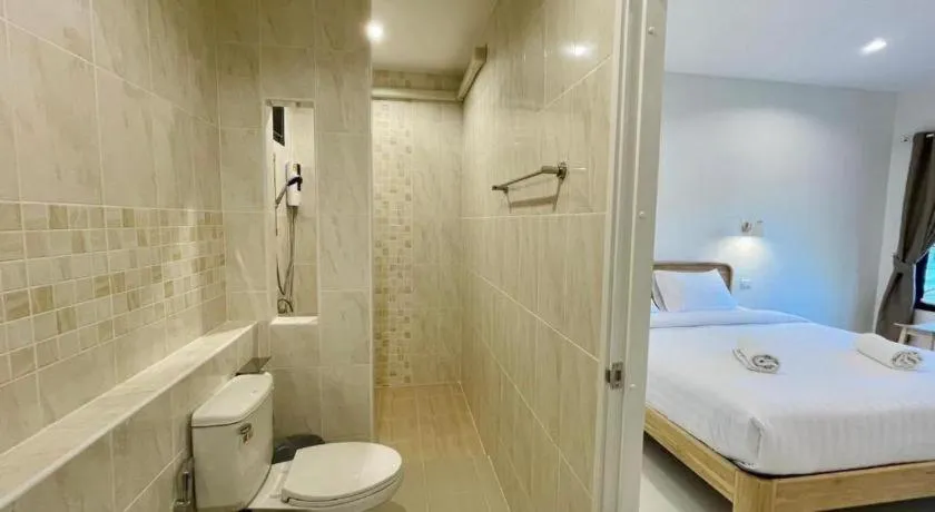 Bed in Baan Klang Suan Resort