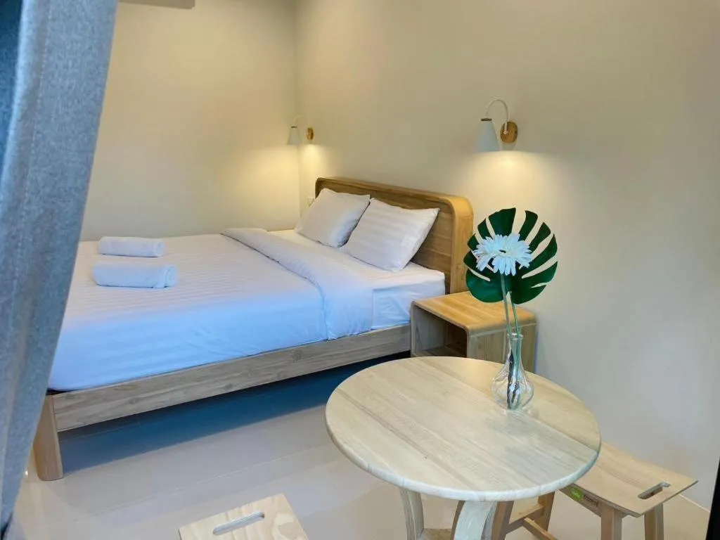 Bed in Baan Klang Suan Resort