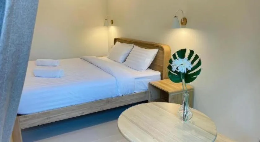 Bed in Baan Klang Suan Resort