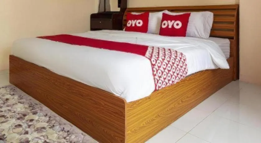 Bed in OYO 75356 Thipsiri Lodge