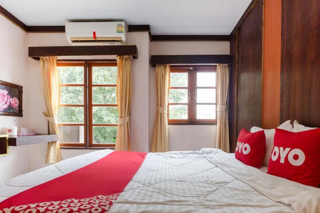 Bed in OYO 75356 Thipsiri Lodge
