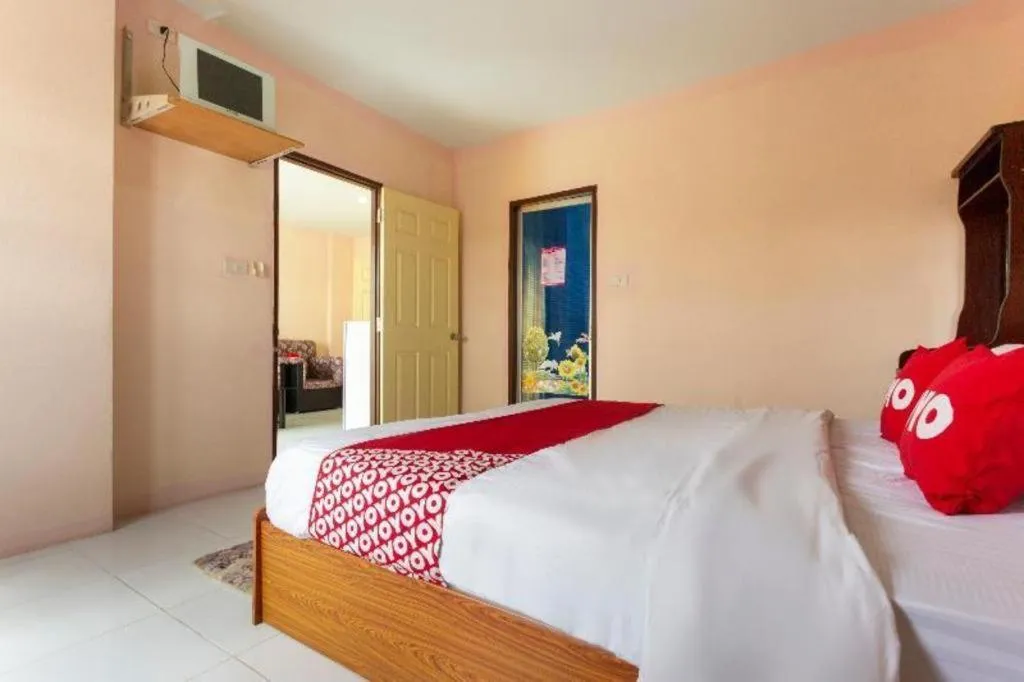 Bed in OYO 75356 Thipsiri Lodge