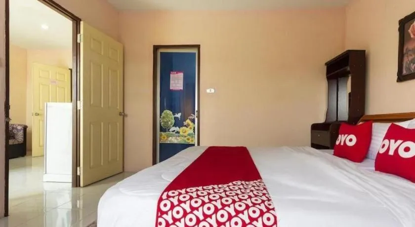 Bed in OYO 75356 Thipsiri Lodge