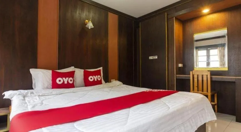 Bed in OYO 75356 Thipsiri Lodge