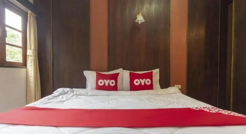 Bed in OYO 75356 Thipsiri Lodge