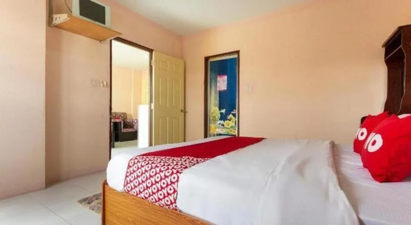 Bed in OYO 75356 Thipsiri Lodge