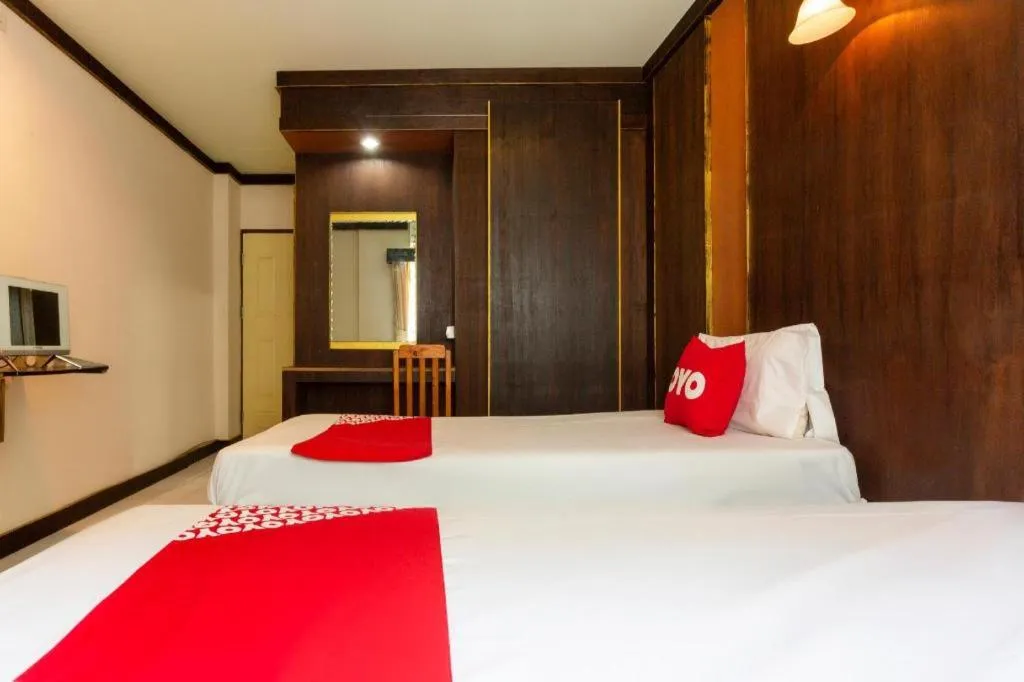 Bed in OYO 75356 Thipsiri Lodge