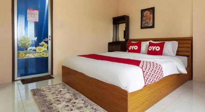 Bed in OYO 75356 Thipsiri Lodge
