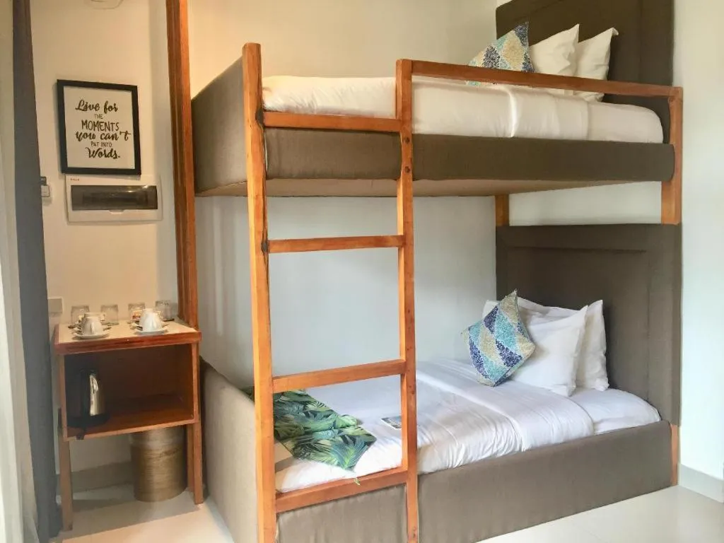 Bed in White Breeze Palawan Boutique Hotel