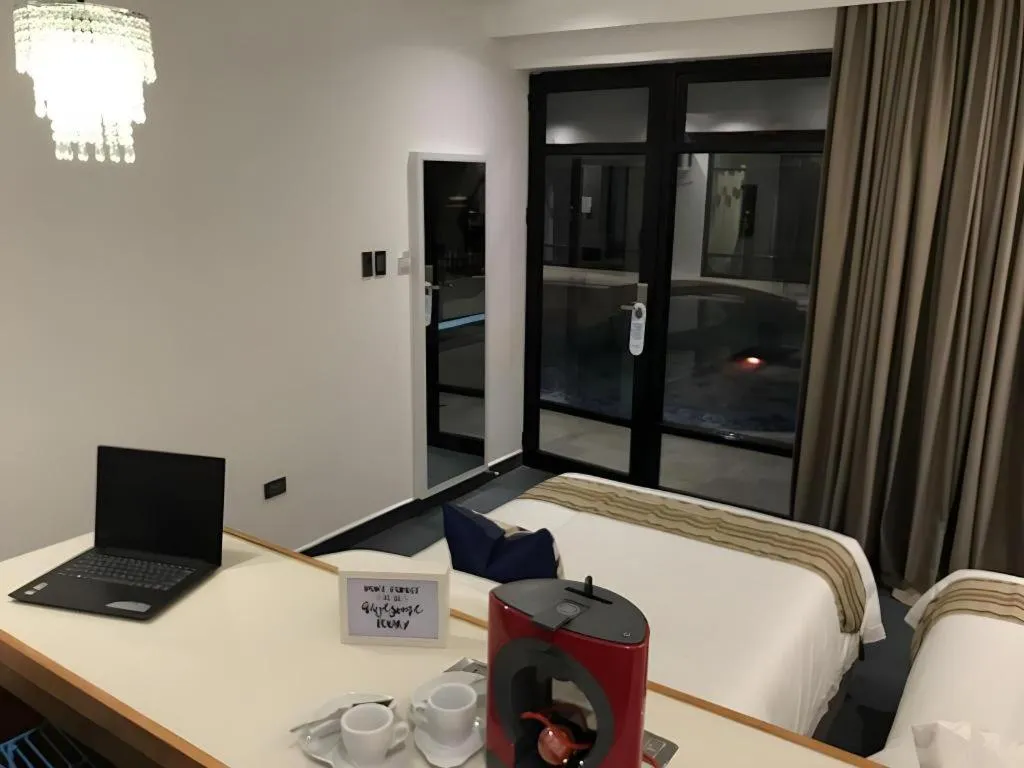 Bed in White Breeze Palawan Boutique Hotel