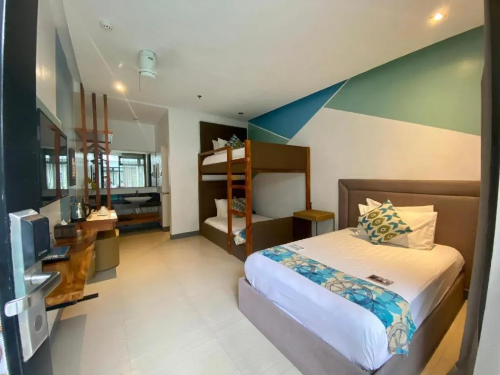 Bed in White Breeze Palawan Boutique Hotel