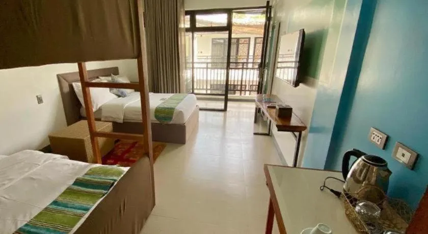 Bed in White Breeze Palawan Boutique Hotel