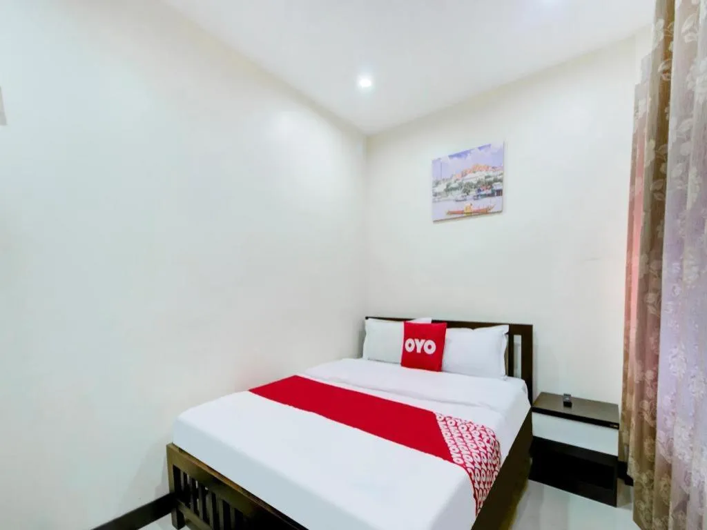 Bed in OYO 253 KK 11 Boutique Inn