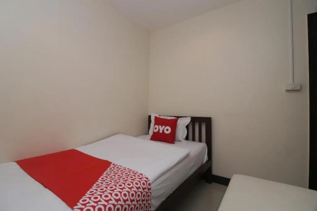Bed in OYO 253 KK 11 Boutique Inn