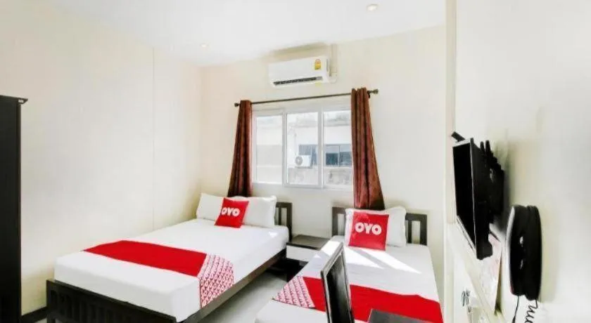 Bed in OYO 253 KK 11 Boutique Inn