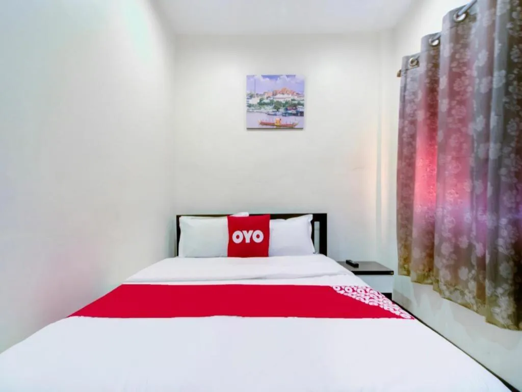 Bed in OYO 253 KK 11 Boutique Inn