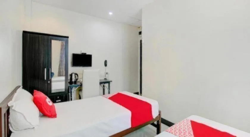 Bed in OYO 253 KK 11 Boutique Inn