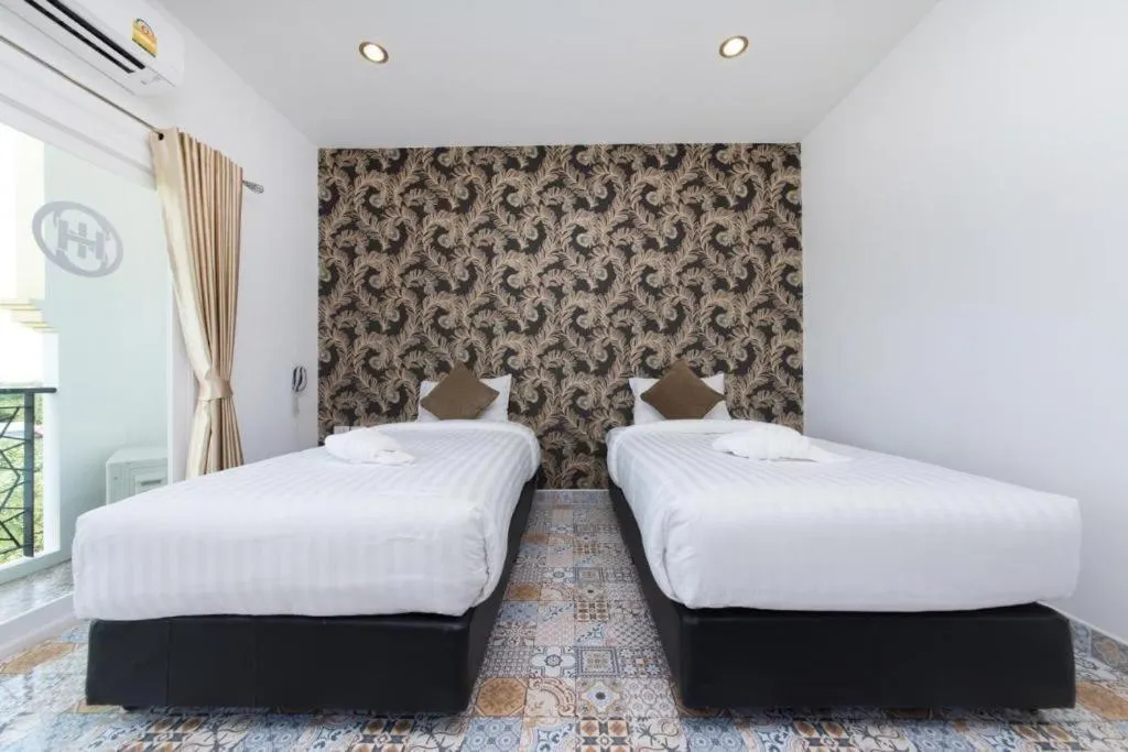 Bed in Oasis Hiso Hotel