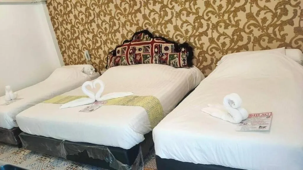 Bed in Oasis Hiso Hotel