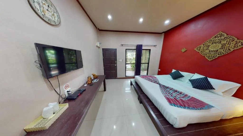 Bed in Sawasdee River Kwai Lodge