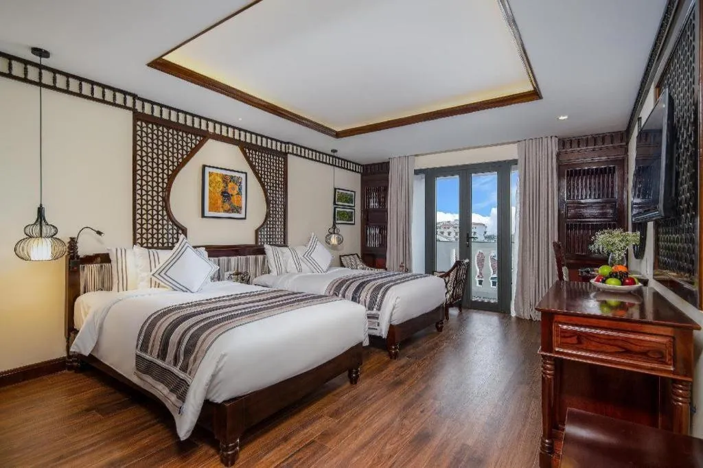 Bed in Le Pavillon Hoi An Paradise Hotel & Spa