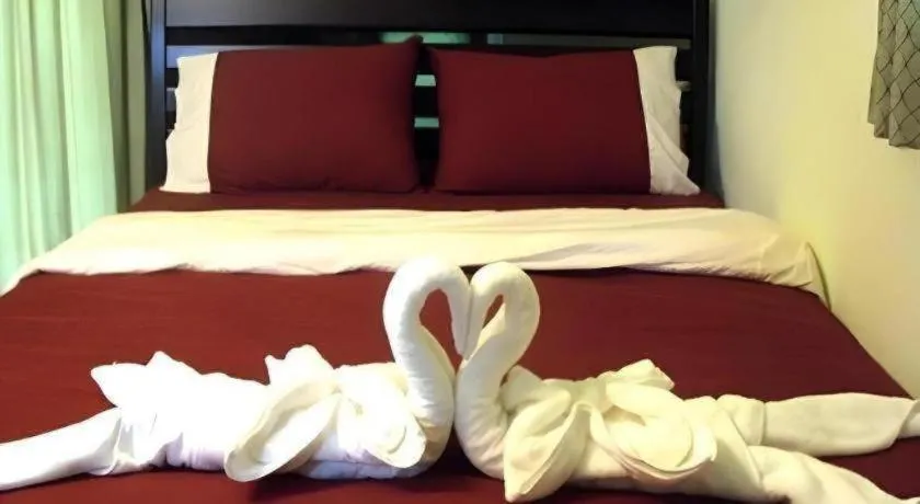 Bed in Green Cottage Beach Resort