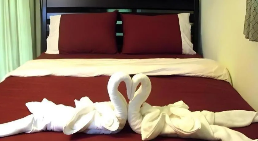 Bed in Green Cottage Beach Resort