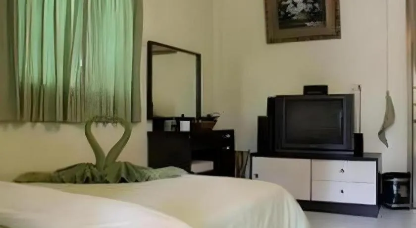 Bed in Green Cottage Beach Resort