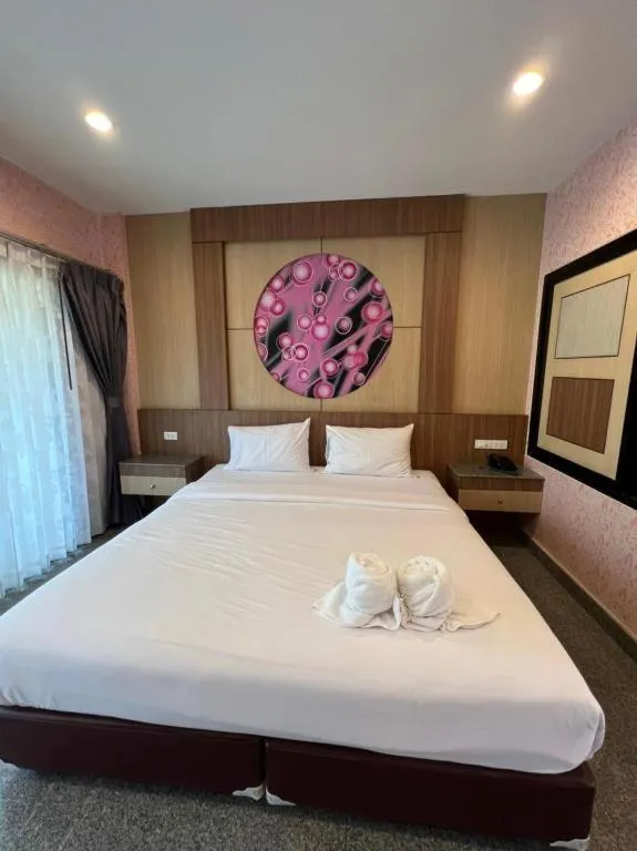 Bed in Manee Sangkha Hotel